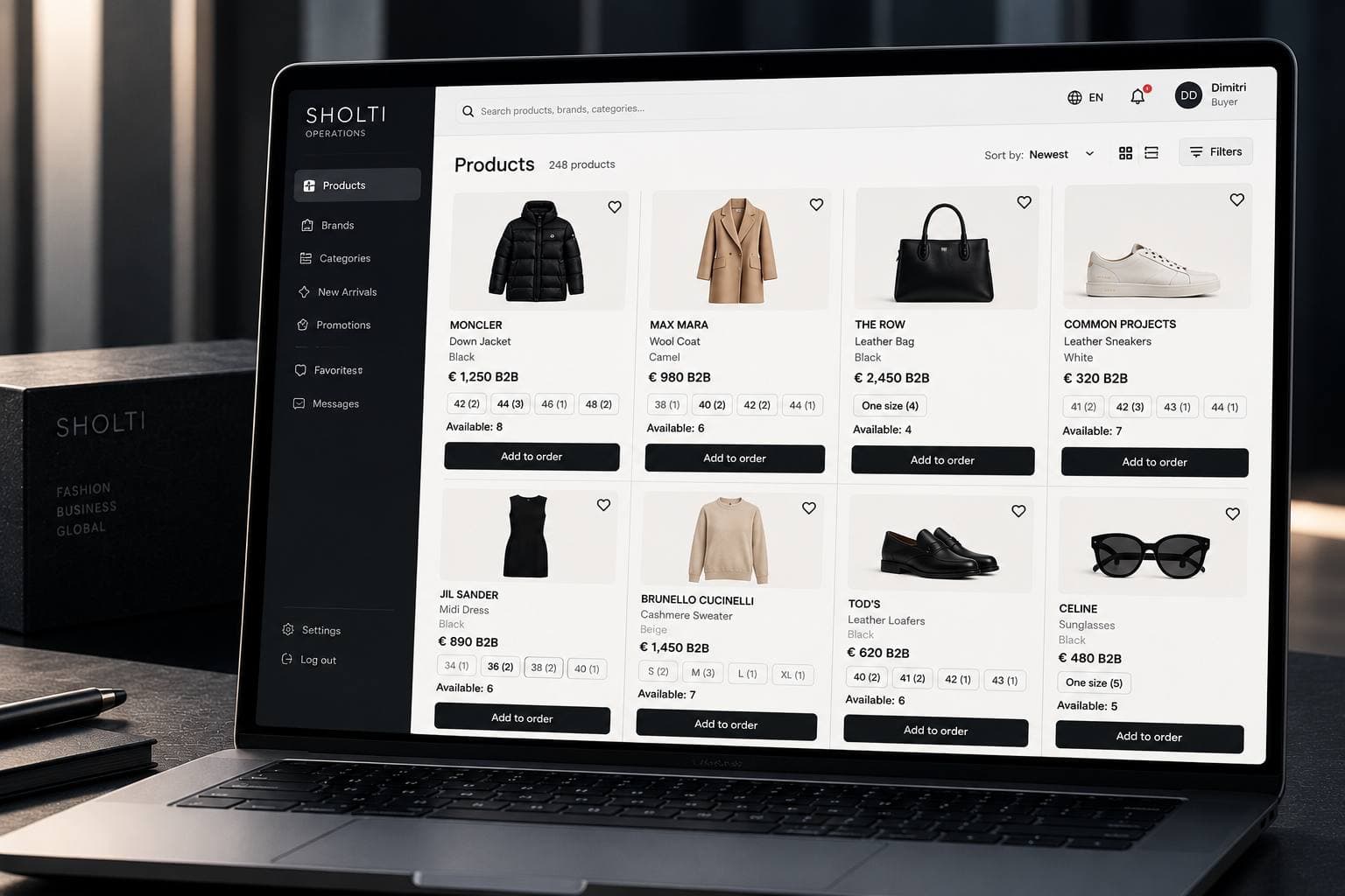 Illustrative SHOLTI B2B product catalogue interface with products, sizes, quantities and ordering controls.
